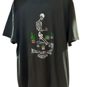Green Graphic Tee with Skeleton and plants Design